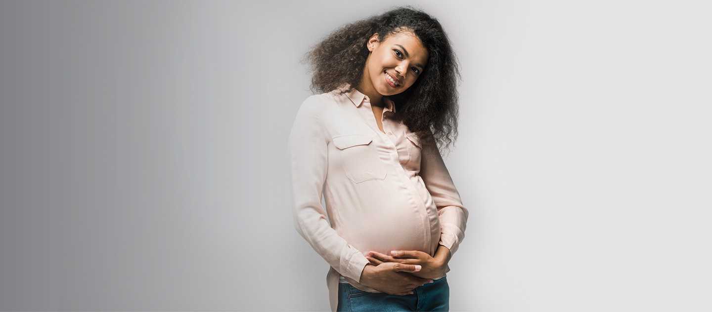 Pregnant woman holding stomach